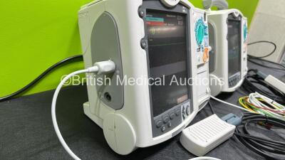 2 x Philips Heartstart MRx Defibrillators (Both Power Up) Including ECG and Printer Options, 2 x Paddle Leads, 2 x Test Loads, 2 x 3 Lead ECG Leads, 2 x Philips M3539A Modules and 2 x Philips M3538A Li-Ion Batteries *SN US00583348 / US00583344* - 6