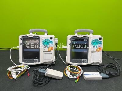 2 x Philips Heartstart MRx Defibrillators (Both Power Up) Including ECG and Printer Options, 2 x Paddle Leads, 2 x Test Loads, 2 x 3 Lead ECG Leads, 2 x Philips M3539A Modules and 2 x Philips M3538A Li-Ion Batteries *SN US00583345 / US00584766*