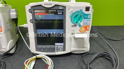 2 x Philips Heartstart MRx Defibrillators (Both Power Up) Including ECG and Printer Options, 2 x Paddle Leads, 2 x Test Loads, 2 x 3 Lead ECG Leads, 2 x Philips M3539A Modules and 2 x Philips M3538A Li-Ion Batteries *SN US00583345 / US00584766* - 2