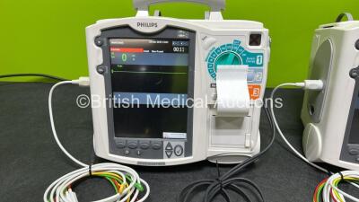 2 x Philips Heartstart MRx Defibrillators (Both Power Up) Including ECG and Printer Options, 2 x Paddle Leads, 2 x Test Loads, 2 x 3 Lead ECG Leads, 2 x Philips M3539A Modules and 2 x Philips M3538A Li-Ion Batteries *SN US00583345 / US00584766* - 3