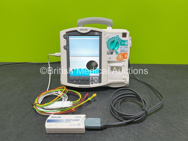 Philips Heartstart MRx Defibrillator (Powers Up with Damaged Screen - See Photos) Including Pacer, ECG and Printer Options, 1 x Paddle Lead, 1 x Test Load, 1 x 3 Lead ECG Lead, 1 x Philips M3539A Module and 1 x Philips M3538A Li-Ion Battery *SN US00583290