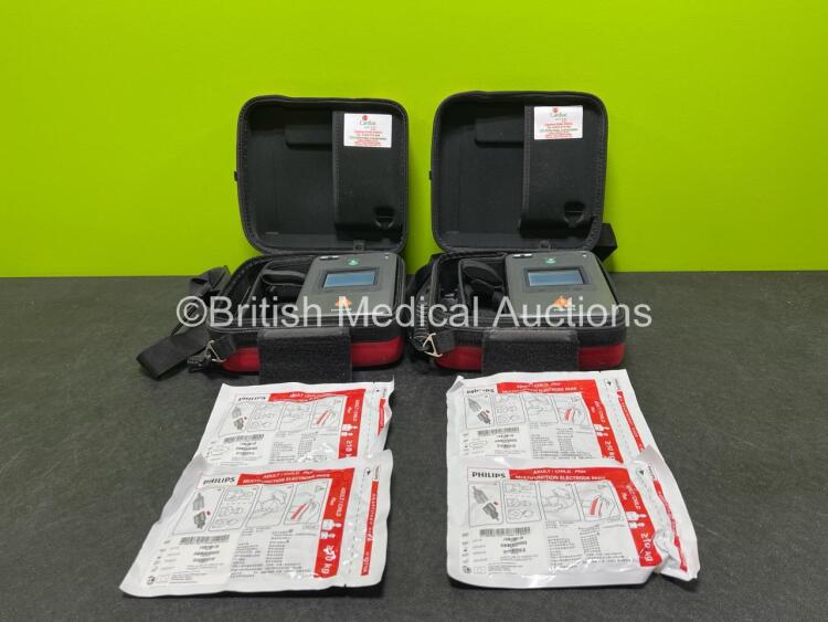 2 x Philips Heartstart FR3 Defibrillators in Carry Cases with 4 x Electrode Packs *2 in Date, 2 Expired* and 2 x LiMnO2 Batteries *Install Before - 2028 / 2025* **SN C17A-00085 / C17A-00078**