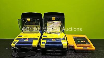 Job Lot Including 2 x Cardiac Science Powerheart AED G3 Automated External Defibrillators in Carry Case (Both Power Up) and 1 x Medtronic Physio Control Lifepak 500 Automated External Defibrillator (No Power Due to Suspected Flat Battery)