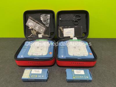 2 x Laerdal Heartstart HS1 Defibrillators with 2 x Lithium Batteries *Install Before 2028 / 2025* and 2 x Electrode Pads *Expire 2024* in Carry Cases (Both Power Up) *SN A05A-02207 / A05A-02216*