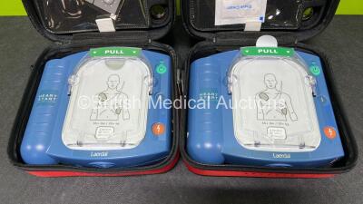 2 x Laerdal Heartstart HS1 Defibrillators with 2 x Lithium Batteries *Install Before 2028 / 2025* and 2 x Electrode Pads *Expire 2024* in Carry Cases (Both Power Up) *SN A05A-02207 / A05A-02216* - 4