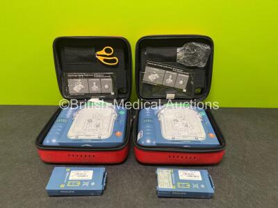 2 x Laerdal Heartstart HS1 Defibrillators with 2 x Lithium Batteries *Install Before 2024 / 2025* and 2 x Electrode Pads *Expire 2024 / 2025* in Carry Cases (Both Power Up) *SN A05A-02217 / A05A-02241*