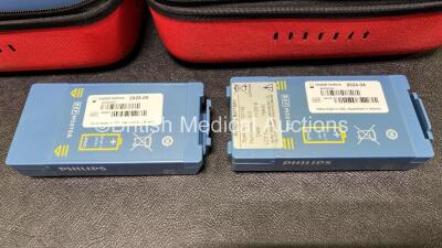 2 x Laerdal Heartstart HS1 Defibrillators with 2 x Lithium Batteries *Install Before 2024 / 2025* and 2 x Electrode Pads *Expire 2024 / 2025* in Carry Cases (Both Power Up) *SN A05A-02217 / A05A-02241* - 2