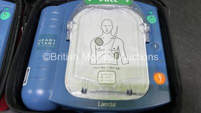 2 x Laerdal Heartstart HS1 Defibrillators with 2 x Lithium Batteries *Install Before 2024 / 2025* and 2 x Electrode Pads *Expire 2024 / 2025* in Carry Cases (Both Power Up) *SN A05A-02217 / A05A-02241* - 5