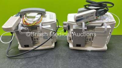 2 x Philips Heartstart MRx Defibrillators (Both Power Up, 1 x Scratched Screen - See Photos) Including ECG and Printer Options, 2 x Paddle Leads, 2 x Test Loads, 2 x 3 Lead ECG Leads, 2 x Philips M3539A Modules and 2 x Philips M3538A Li-Ion Batteries *SN - 7