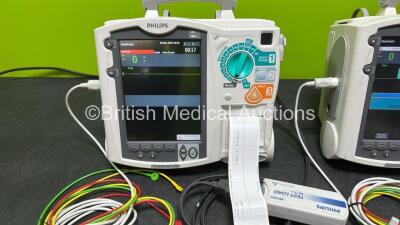 2 x Philips Heartstart MRx Defibrillators (Both Power Up, 1 x Scratched Screen - See Photos) Including ECG and Printer Options, 2 x Paddle Leads, 2 x Test Loads, 2 x 3 Lead ECG Leads, 2 x Philips M3539A Modules and 2 x Philips M3538A Li-Ion Batteries *SN - 3