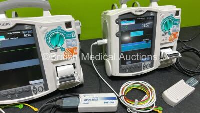 2 x Philips Heartstart MRx Defibrillators (Both Power Up, 1 x Scratched Screen - See Photos) Including ECG and Printer Options, 2 x Paddle Leads, 2 x Test Loads, 2 x 3 Lead ECG Leads, 2 x Philips M3539A Modules and 2 x Philips M3538A Li-Ion Batteries *SN - 4