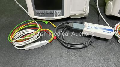 2 x Philips Heartstart MRx Defibrillators (Both Power Up, 1 x Scratched Screen - See Photos) Including ECG and Printer Options, 2 x Paddle Leads, 2 x Test Loads, 2 x 3 Lead ECG Leads, 2 x Philips M3539A Modules and 2 x Philips M3538A Li-Ion Batteries *SN - 5