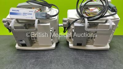 2 x Philips Heartstart MRx Defibrillators (Both Power Up, 1 x Scratched Screen - See Photos) Including ECG and Printer Options, 2 x Paddle Leads, 2 x Test Loads, 2 x 3 Lead ECG Leads, 2 x Philips M3539A Modules and 2 x Philips M3538A Li-Ion Batteries *SN - 7