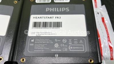 3 x Philips Heartstart FR3 Defibrillators in Carry Cases with 4 x Electrode Packs *2 in Date, 2 Expired* and 2 x LiMnO2 Batteries *Install Before - 2027 / 2024* **SN C17A-00145 / C16H-00370** - 5