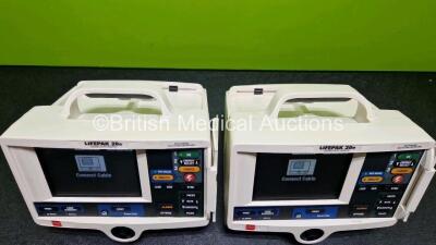 2 x Lifepak 20e Defibrillators / Monitors *Mfd - 2020 / 2016* (Both Power Up) Including Pacer, ECG and Printer Options with 2 x Li-ion Batteries *SN 48697293 / 44641952* - 5