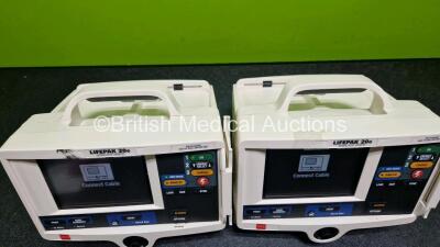 2 x Lifepak 20e Defibrillators / Monitors *Mfd - 2016 / 2016* (Both Power Up) Including ECG and Printer Options with 2 x Li-ion Batteries *SN 44606464 / 44646902* - 5