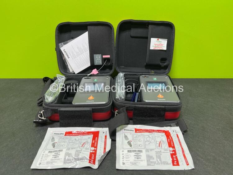 2 x Philips Heartstart FR3 Defibrillators in Carry Cases with 2 x Electrode Packs *Both Expired* and 2 x LiMnO2 Batteries *Install Before - 2024 / 2025* **SN C13C-00395 / C18G-01448**