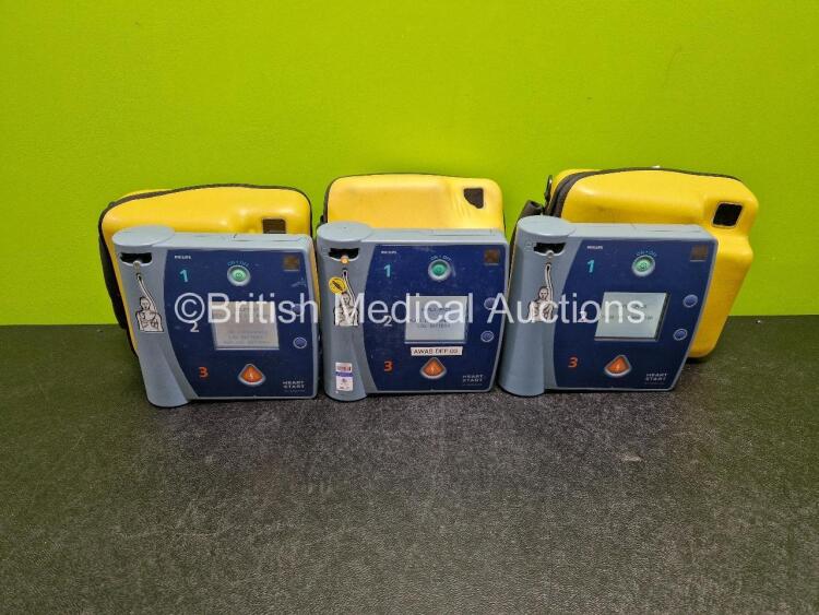 3 x Philips FR2+ Defibrillators (All Power Up) in Case with 3 x M3863A LiMnO2 Batteries *Install Before - 2023 / 2018 / 2020*