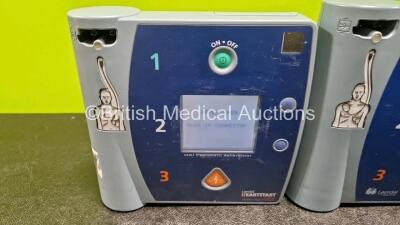 Job Lot Including 2 x Laerdal FR2 Heartstart Defibrillators, 1 x Laerdal FR2+ Defibrillators (All Power Up) with 3 x M3863A LiMnO2 Batteries *Install Before - 2023 / 2026 / 2022* - 2