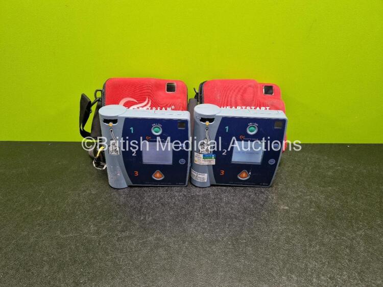 2 x Agilent FR2 Heartstream Defibrillators (Both Power Up) in Case with 2 x M3863A LiMnO2 Batteries *Install Before - 2027 / 2020*