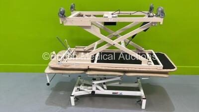 1 x Medi-Plinth hydraulic Patient Examination Couch (Hydraulics Tested Working) and 1 x Bristol Maid Electric Patient Examination Couch (Unable to Power Test Due to No Controller - Damaged Wheel) *S/N 40101*