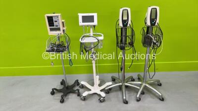 2 x Welch Allyn 420 Series Vital Signs Monitors on Stands, 1 x Welch Allyn Connex Patient Monitor on Stand and 1 x Datascope Accutorr Plus Vital Signs Monitor on Stand (All Power Up)