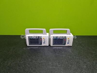 2 x Philips IntelliVue X2 Handheld Patient Monitors Including ECG, SpO2, NBP, Press and Temp Options (Both Power Up with Stock Battery - Stock Battery Not Included) with 2 x Philips M4607A Li-Ion Batteries (Both Flat)
