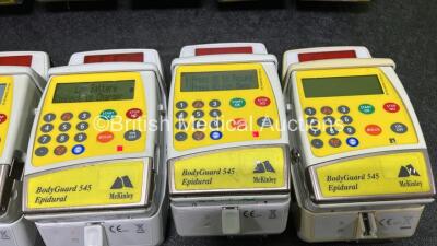 9 x McKinley 545 Bodyguard Epidural Infusion Pumps with 9 x Pump Chargers (8 x Power Up, 1 x No Power, 1 x Mark On Screen, 3 x Damaged Cases and 8 x Missing Batteries - See Photos) - 5