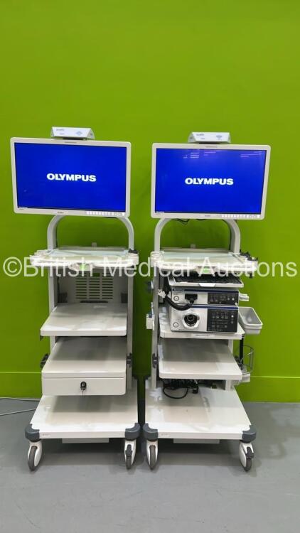 2 x Olympus Stack Trolleys with 2 x Olympus OEV262H Monitors, Olympus Evis Lucera Elite CV-290 Digital Processor, Olympus Evis ELite CLV-290SL Light Source, Olympus MAJ-1911 Pigtail Connector and NFS Transmitter and Receiver (All Powers Up - Professionall