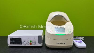 Mixed Lot Including 1 x Baxter EvoIQ LVP Infusion Pump *SN 2020*, 1 x Medela Warming Unit and 1 x NeuroTrac Continence Dual Channel NMS Stimulator (All Power Up) *SN SK00501437 / 1305251*