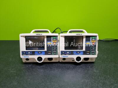 2 x Physio Control Medtronic Lifepak 20 Defibrillators / Monitors *Mfd 2004 / 2004 (Both Power Up, Both Missing Door) Including Pacer, ECG and Printer Options *ri*
