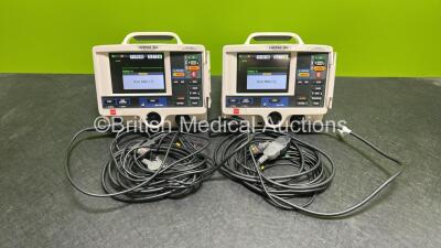 2 x Lifepak 20e Defibrillators / Monitors *Mfd - 2015 / 2015* (Both Power Up) Including Pacer, ECG and Printer Options with 2 x Li-ion Batteries, 2 x ECG Leads and 2 x Paddle Cables *SN 4381361 / 43874906*