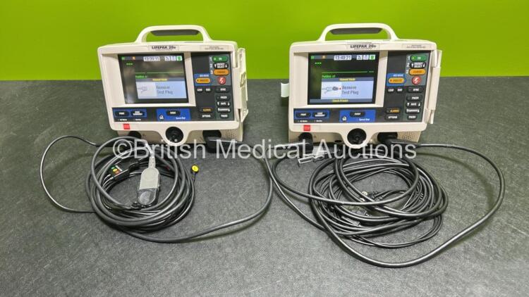 2 x Lifepak 20e Defibrillators / Monitors *Mfd - 2015 / 2015* (Both Power Up) Including Pacer, ECG and Printer Options with 2 x Li-ion Batteries, 2 x ECG Leads and 2 x Paddle Cables *SN 43881329/ 43880823*