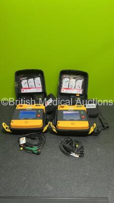 2 x Medtronic Lifepak 1000 Defibrillators (Both Power Up) in Carry Cases with 2 x Lithium Batteries *Install Before - 2025-07 / 2028-04* and 2 x Lead ECG Leads *SN 43820821 / 43820819*