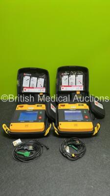 2 x Medtronic Lifepak 1000 Defibrillators (Both Power Up - 1 x Crack to Display - See Photo) in Carry Cases with 2 x Lithium Batteries *Install Before - 2024-03 / 2029-09* and 2 x Lead ECG Leads *SN 45039886/ 45039880*