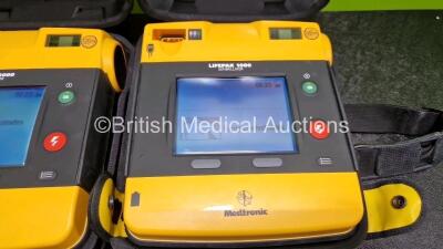 2 x Medtronic Lifepak 1000 Defibrillators *Mfd - 2013 / 2009* (Both Power Up) in Carry Case with 2 x Li/Mn02 Batteries *Install Before - 2024 / 2028* - 3