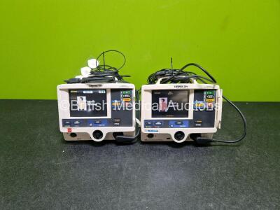2 x Lifepak 20e Defibrillators / Monitors *Mfd - 2017 / 2007* (Both Power Up, 1 x Missing Door) Including ECG and Printer Options with 2 x Li-ion Batteries, 2 x ECG Leads and 2 x Paddle Cables