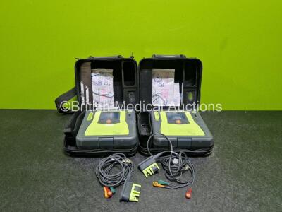 2 x Zoll AED PRO Defibrillators (Both Power Up,1 x with Damaged Screen) In Carry Case with 2 x 3 Lead ECG Leads and 2 x Batteries