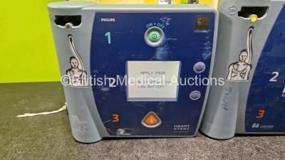Job Lot Including 1 x Laerdal FR2+ Heartstart Defibrillator, 1 x Philips FR2+ Heartstart Defibrillator (Both Power Up) in Case with 2 x M38623A LiMnO2 Batteries *Install Before - 2024 / 2021* - 2